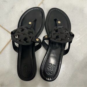 Two pairs of Tory Burch sandals.